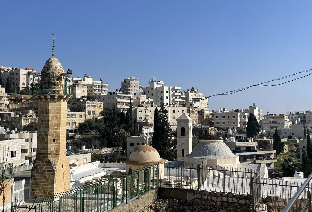 Lazarus' tomb is located between the mosque (in the foreground) and the Franciscan church (in the background)