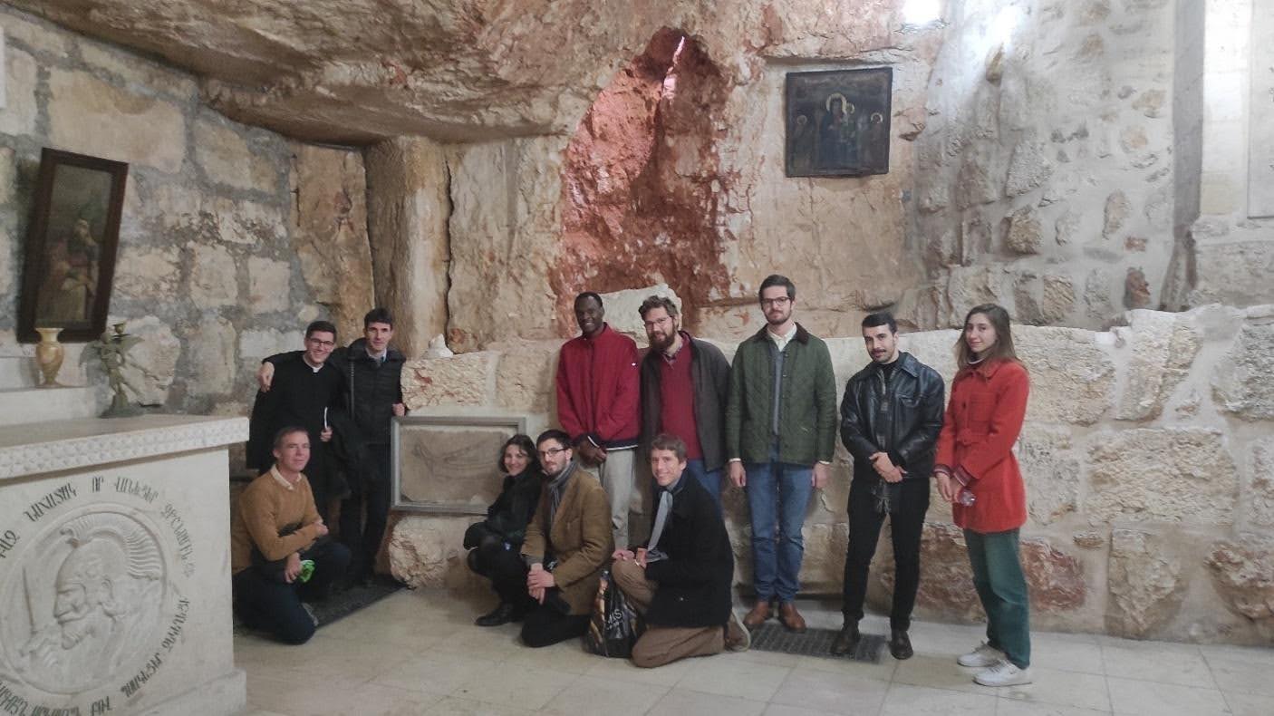Chapel of Saint Vartan: a group of students posing around the famous graffito Domine Ivimus. Photo: Henri Gourinard.